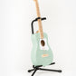 mint green pro VI acoustic guitar on loog stand