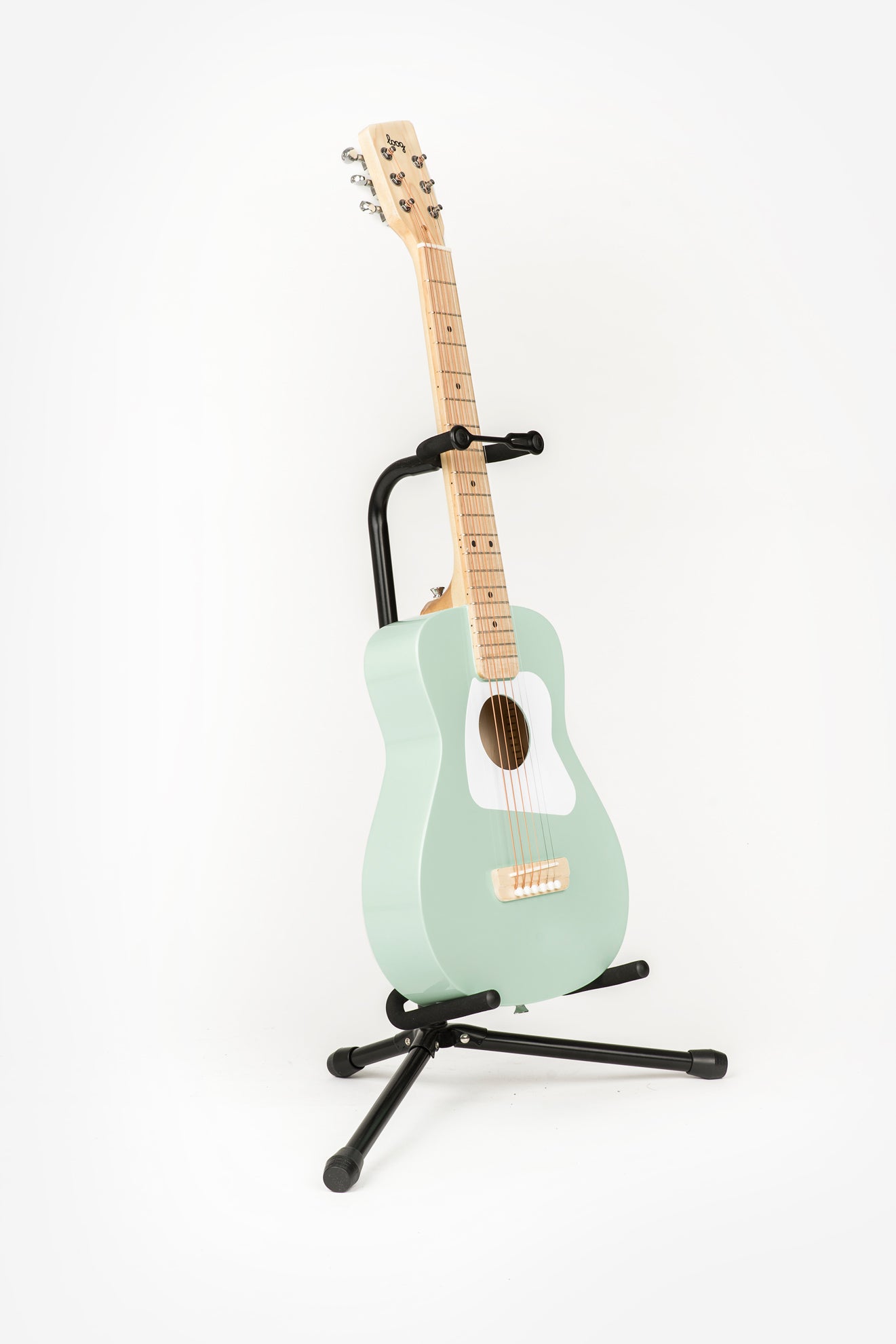 mint green pro VI acoustic guitar on loog stand