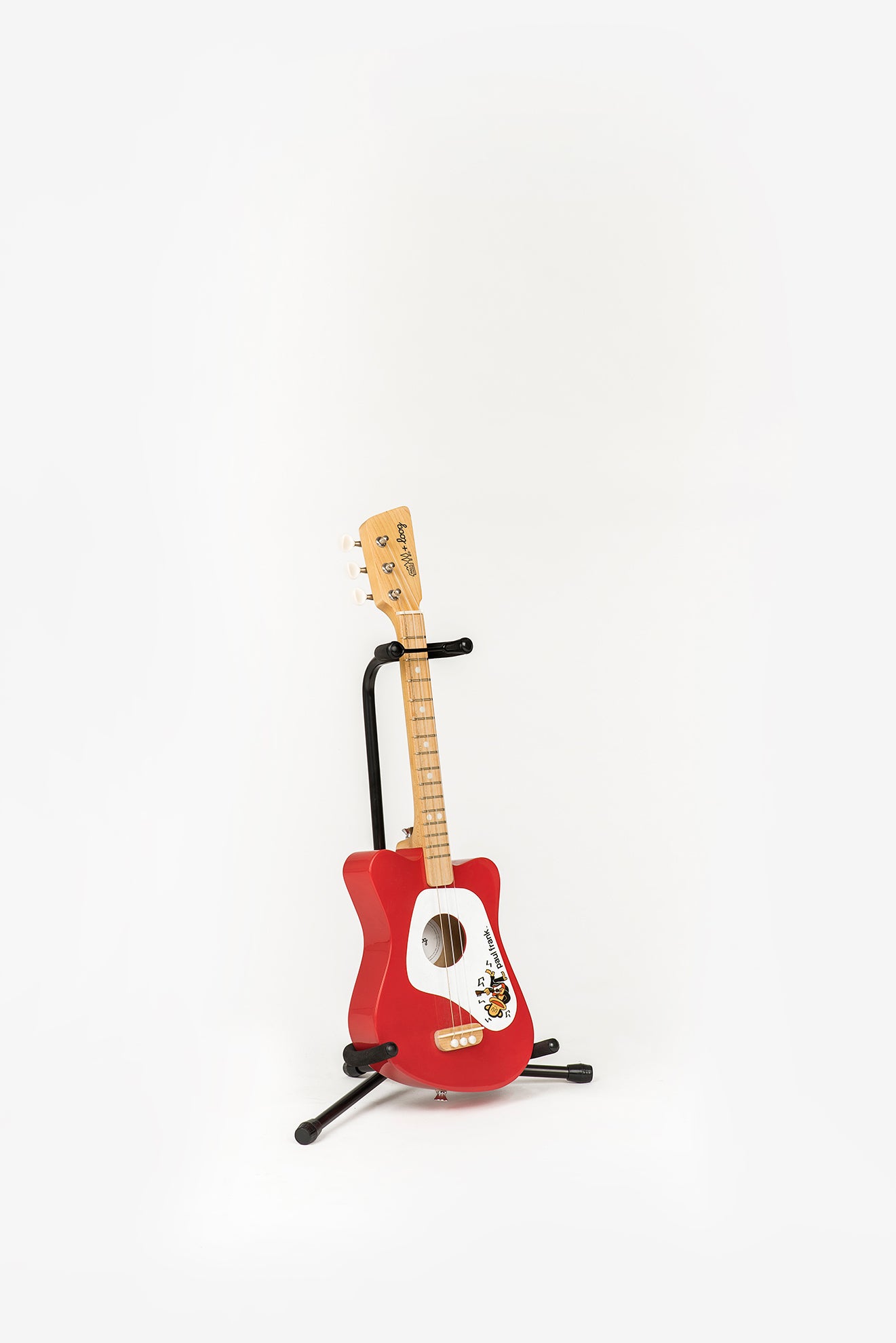 red mini guitar on loog stand