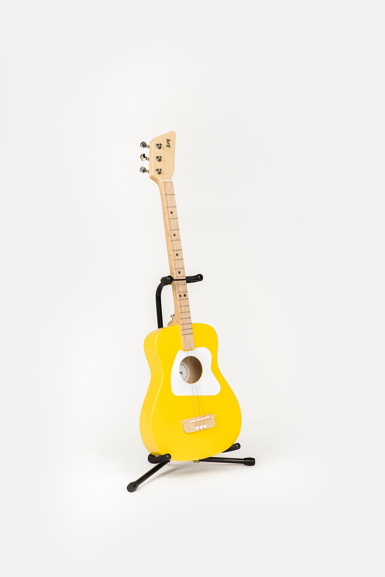 yellow pro guitar on loog stand