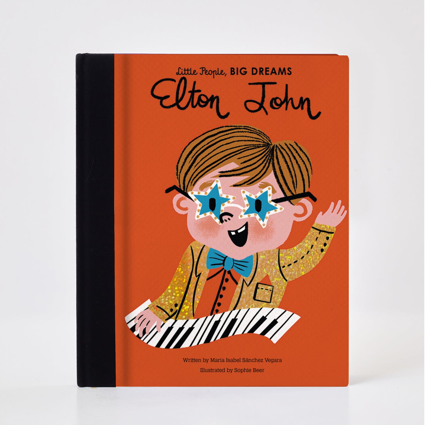 Meet Elton John: the piano wizard who rocketed to stardom with his music.  As a child, Elton started playing his grandmother's piano in Harrow, London. He could pick tunes out by ear and was soon attending lessons at the Royal Academy. After answering an advertisement in a newspaper, Elton teamed up with a lyric-writing buddy: Bernie Taupin. The rest was history. Elton's songwriting talent, musical skill, and dazzling outfits have made him one of the all-time greats. 
