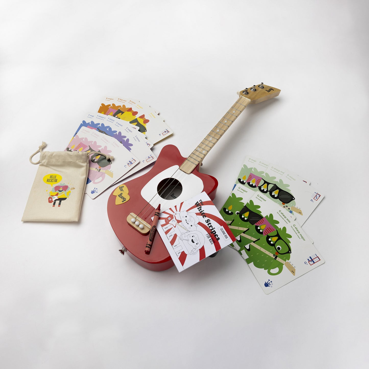This limited edition of our beloved Loog Mini sports the White Stripes' peppermint logo in the back of the guitar body, comes with a "White Stripes for Kids" coloring book, chord flashcards and app access. We even include a red crayon! 🖍️